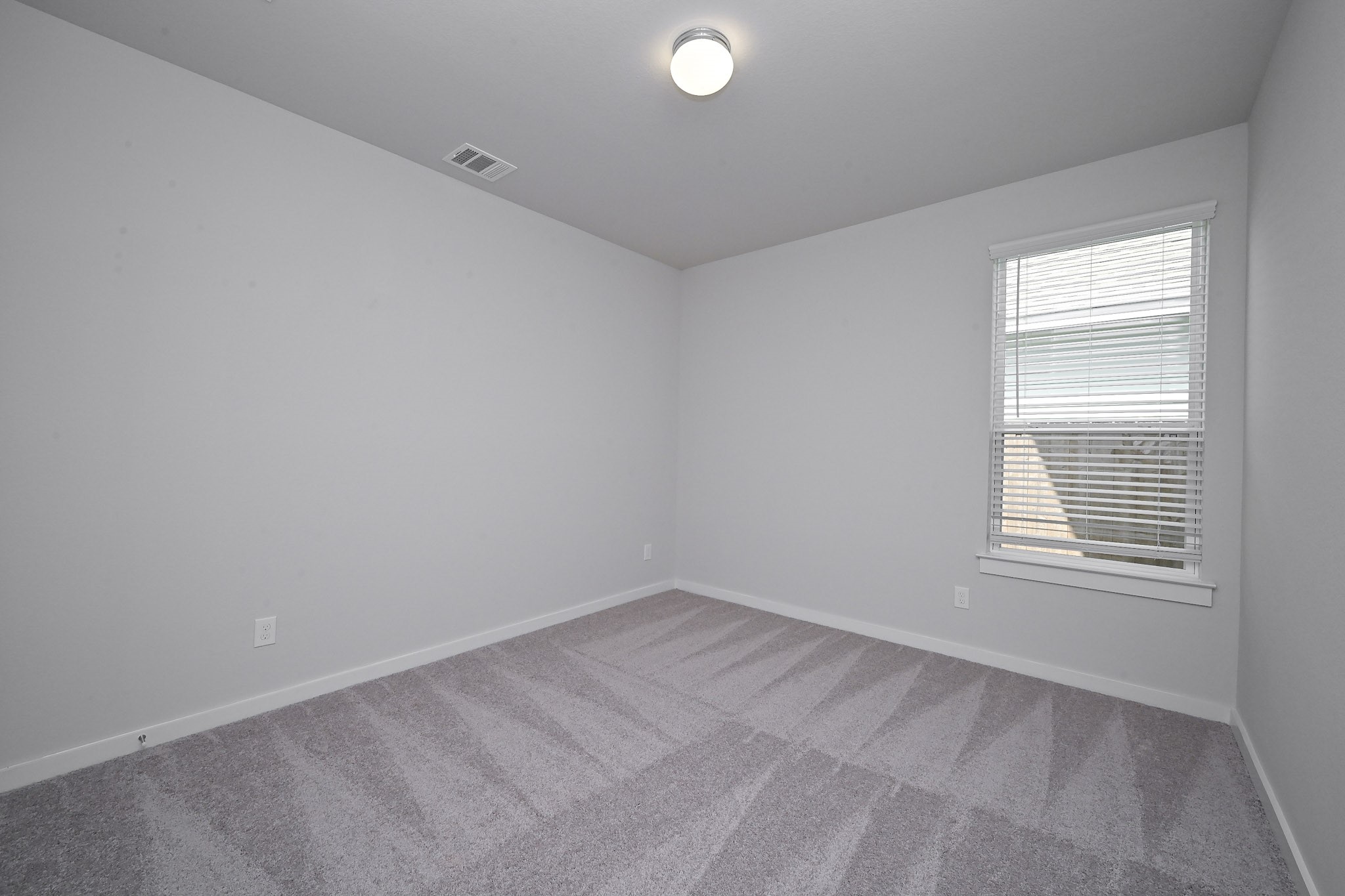 33019 School Hl Road Fulshear, TX 77441 - Photo 33 of 38 an empty room with a window