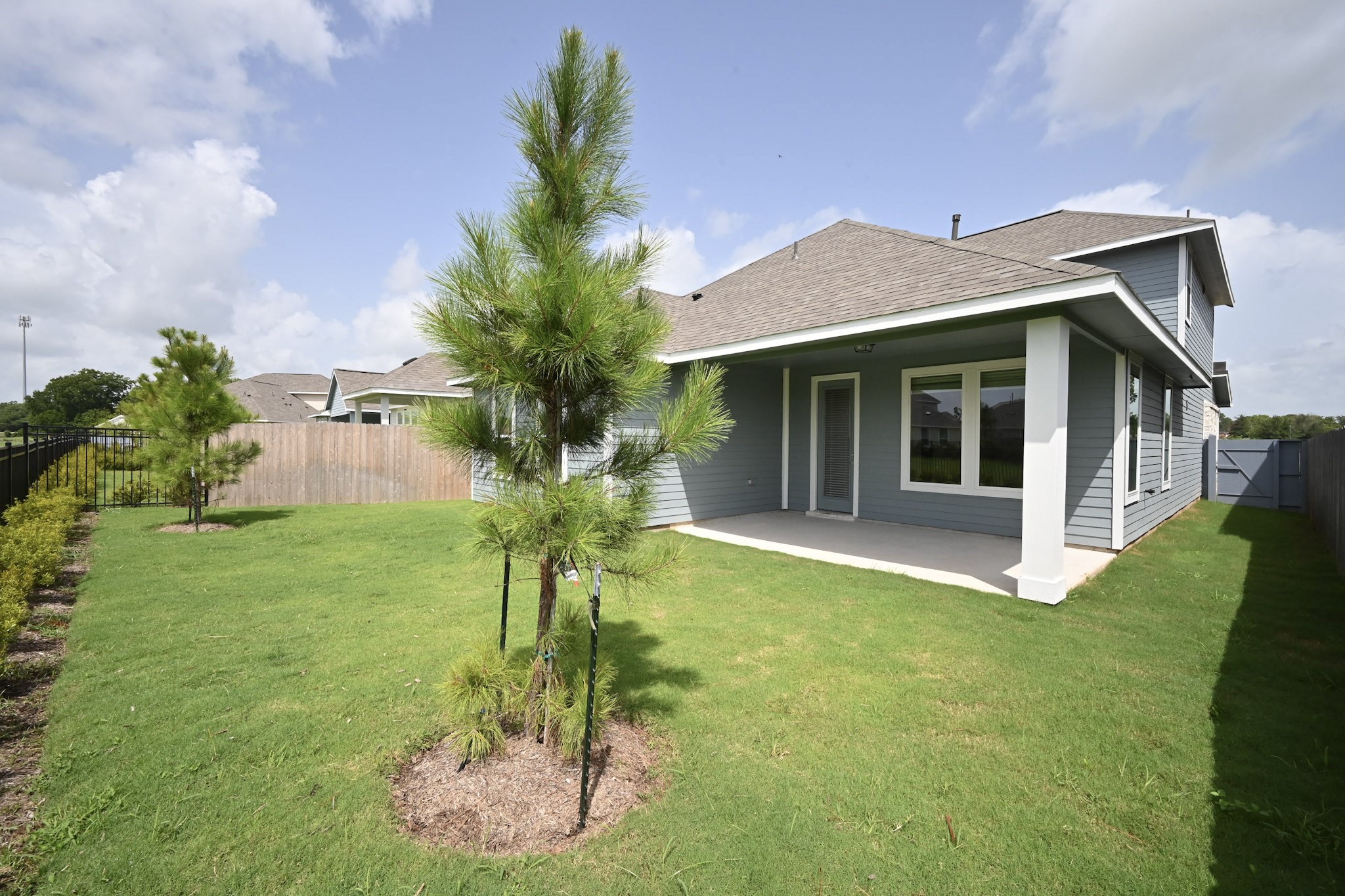33019 School Hl Road Fulshear, TX 77441 - Photo 36 of 38 a front view of a house with a yard