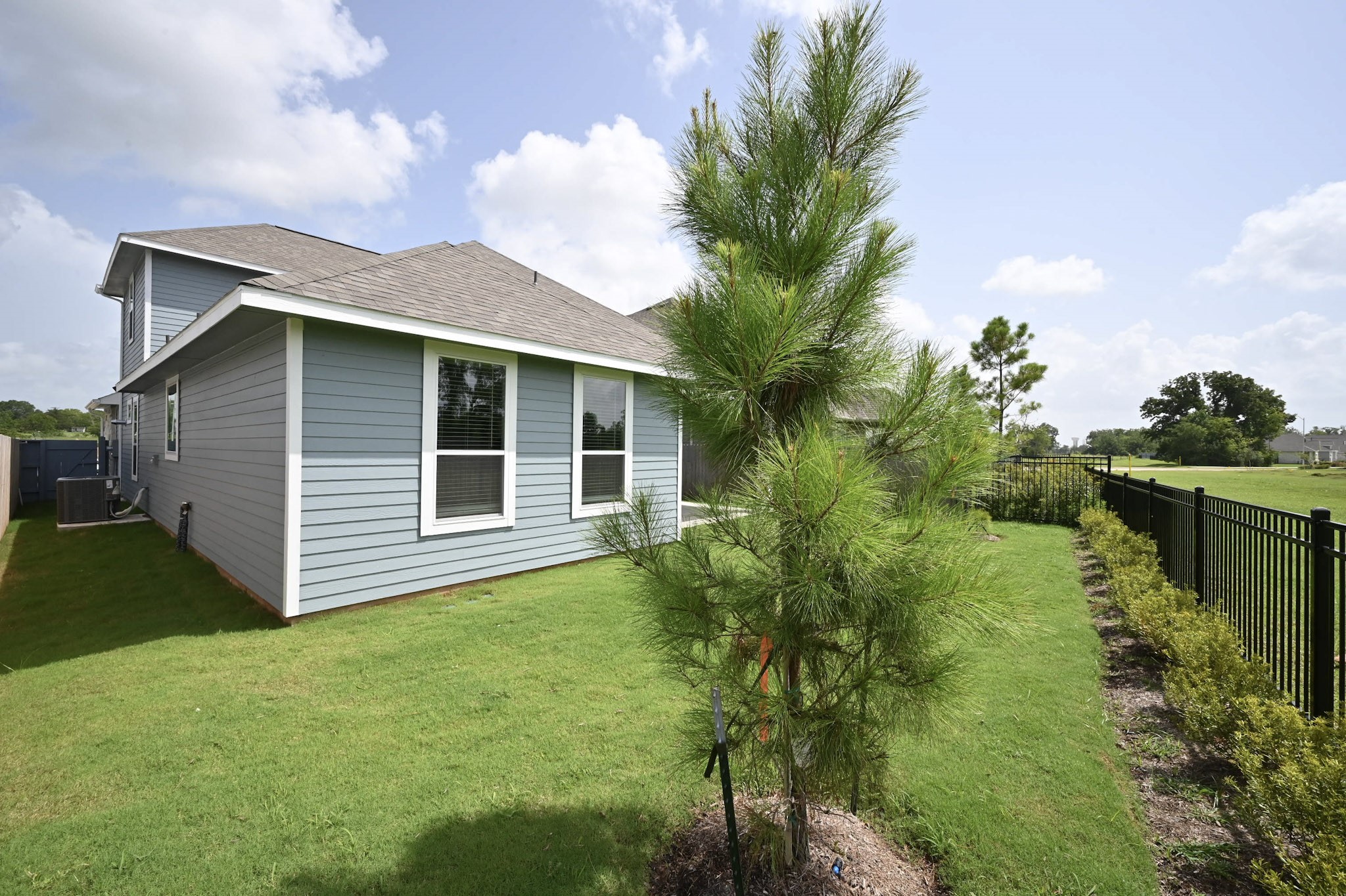 33019 School Hl Road Fulshear, TX 77441 - Photo 37 of 38 a front view of house with yard and green space
