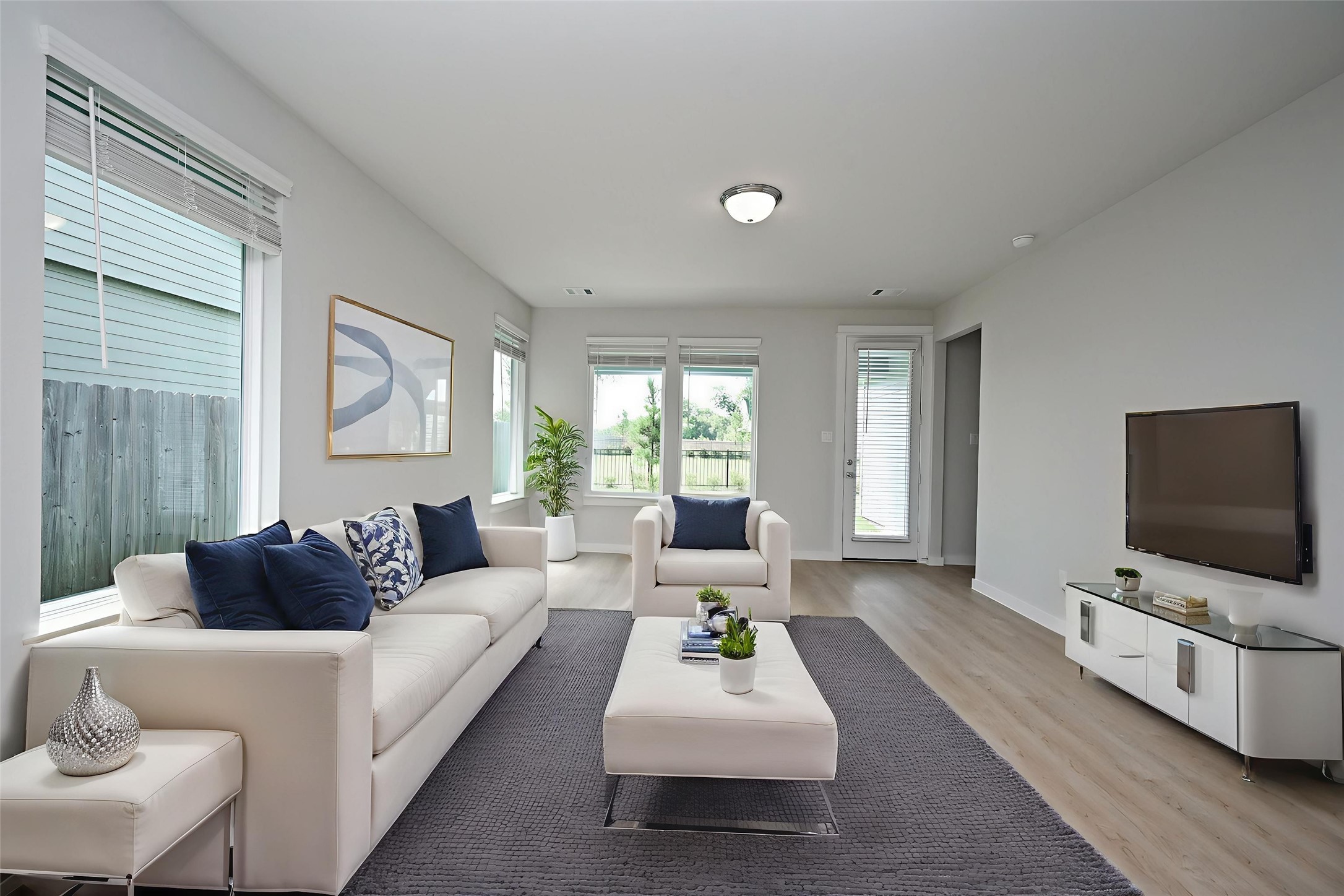 33019 School Hl Road Fulshear, TX 77441 - Photo 7 of 38 a living room with furniture and a flat screen tv
