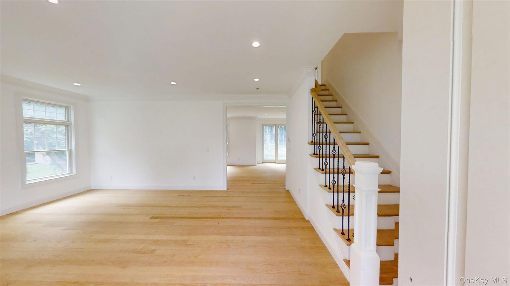 10 Winfield Drive Sound Beach, NY 11789 - Photo 3 of 11 a view of entryway and hall with wooden floor