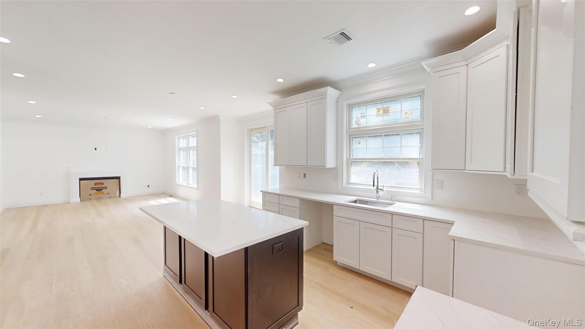 10 Winfield Drive Sound Beach, NY 11789 - Photo 11 of 11 a kitchen with a sink cabinets and window