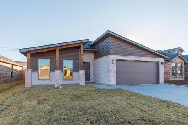a front view of house with garage