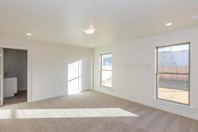 a view of an empty room and window