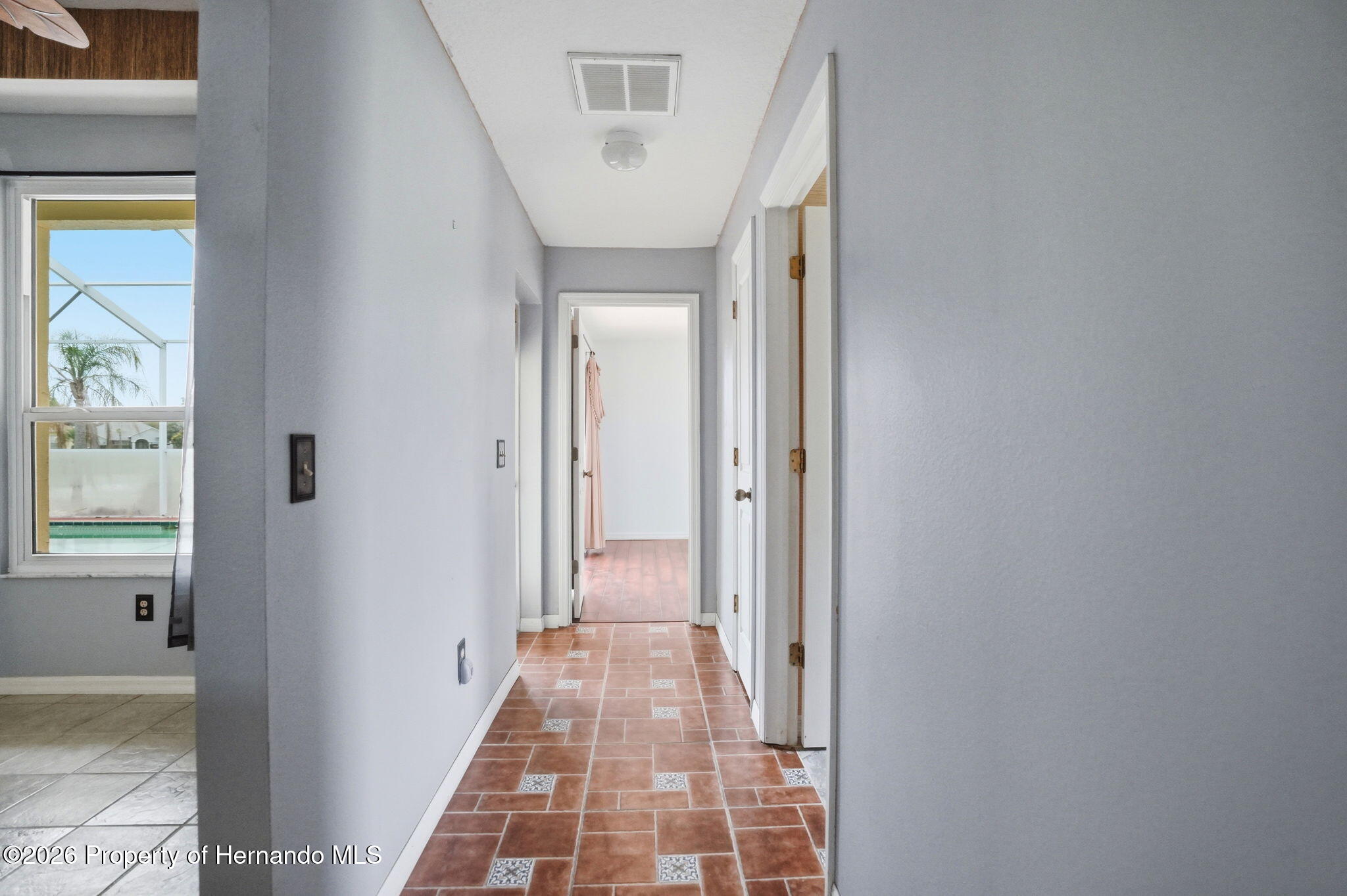 18131 Rivard Boulevard Brooksville, FL 34604 - Photo 35 of 66 a view of a hallway with a white walls