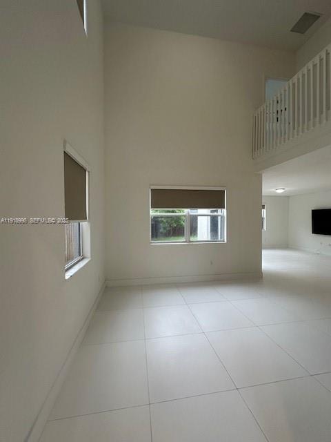 1405 Southeast 26th Avenue, Unit 1405 Homestead, FL 33035 - Photo 2 of 16 a view of an empty room with a window