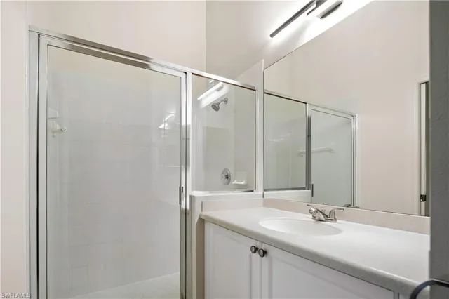 a bathroom with a double vanity sink mirror and double