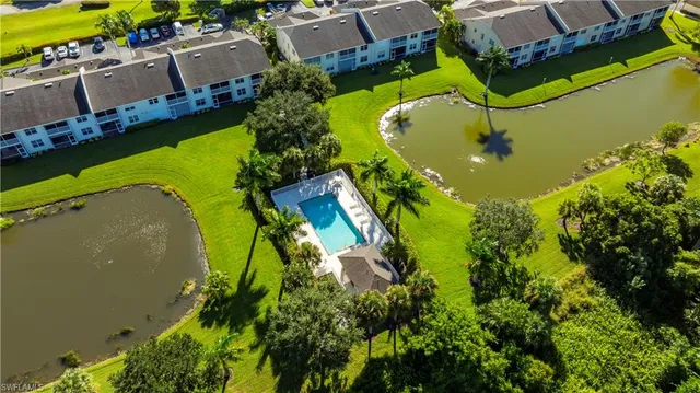 an aerial view of a house with a swimming pool