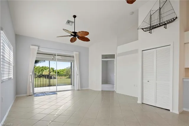 a view of a room with a ceiling fan