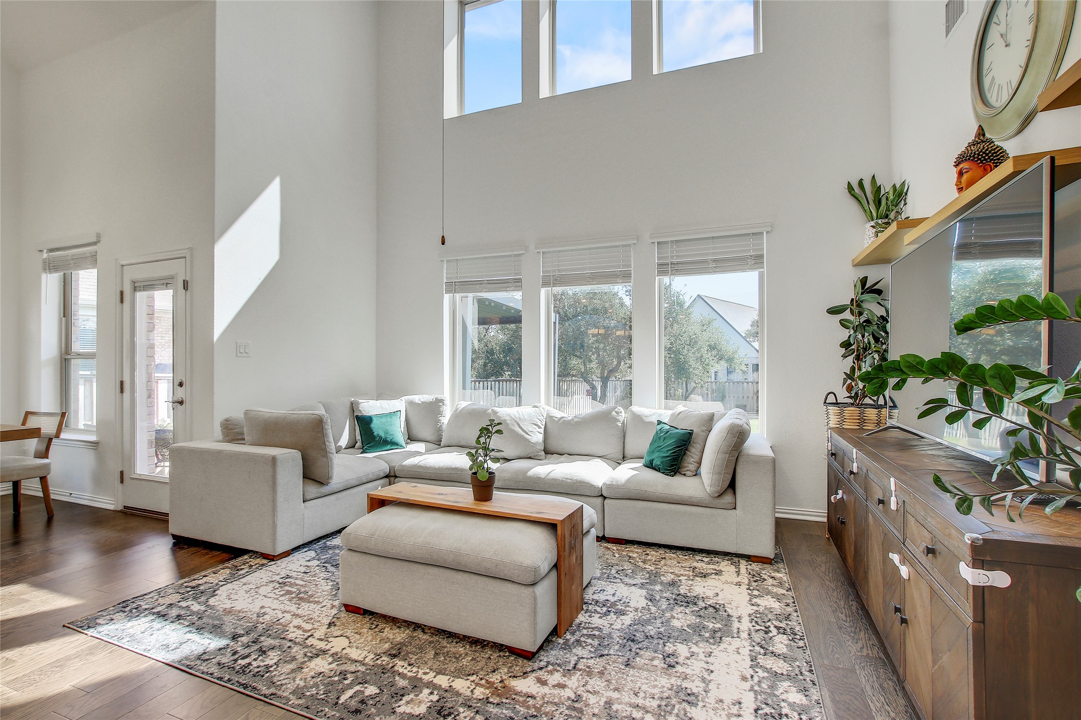 104 Millbend Road Georgetown, TX 78633 - Photo 17 of 40 High ceilings and abundant windows flood this inviting living space with natural light.