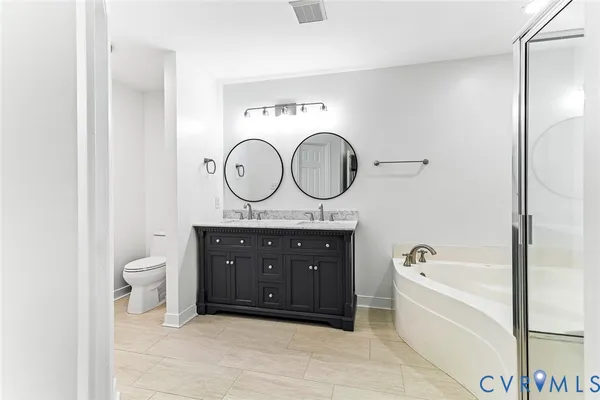 a bathroom with a toilet a sink and a bathtub