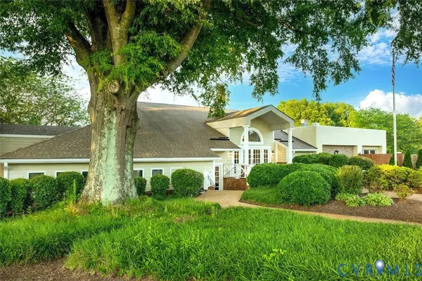 a view of front of house with a yard