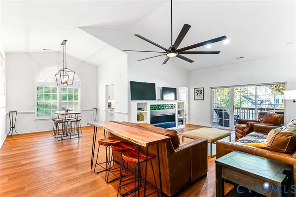a view of a dining room with furniture window and wooden floor