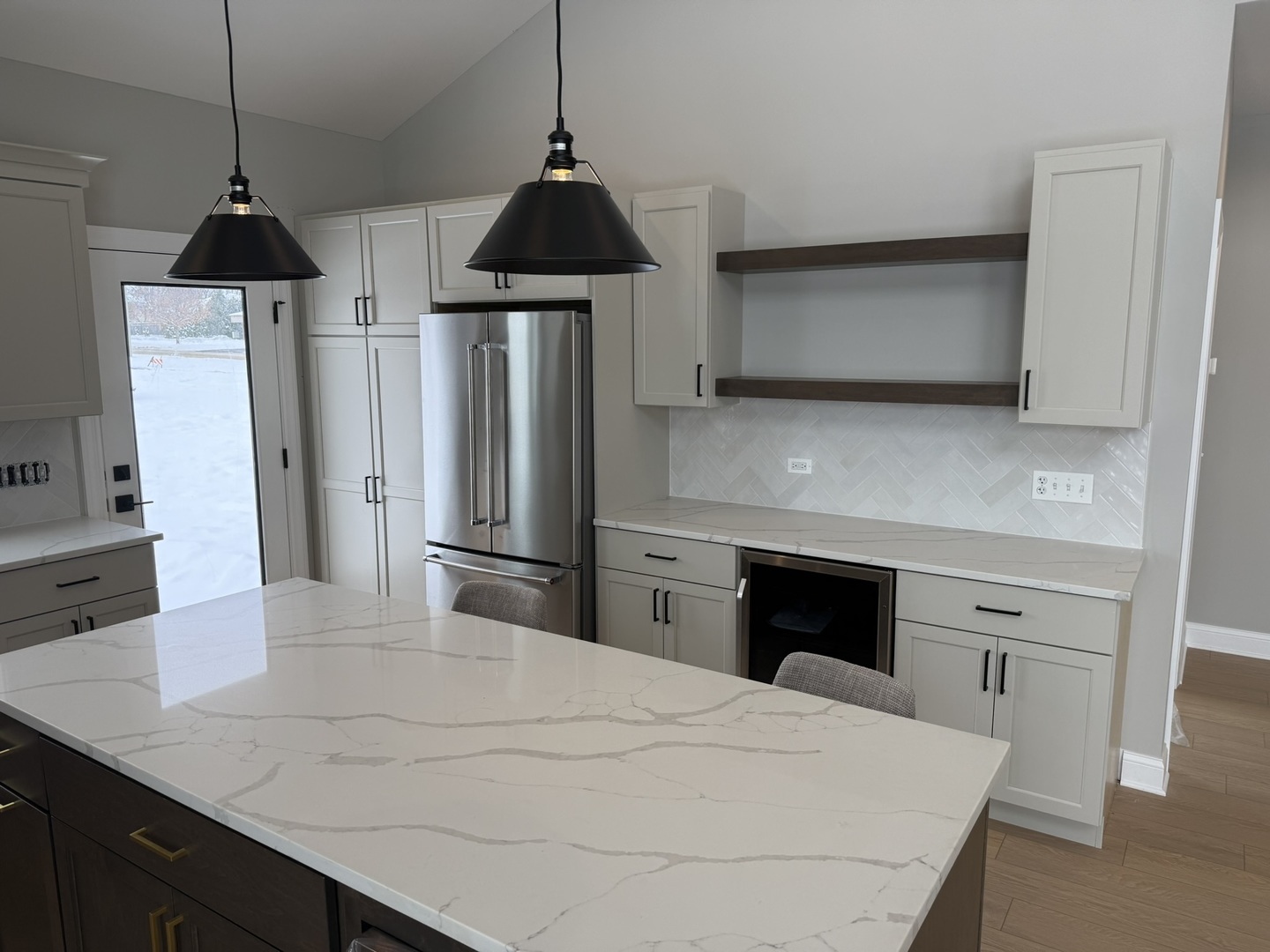 1236 Prairie Lane, Unit 5B Lemont, IL 60439 - Photo 14 of 28 a kitchen with stainless steel appliances a kitchen island a stove a refrigerator a sink and a fireplace