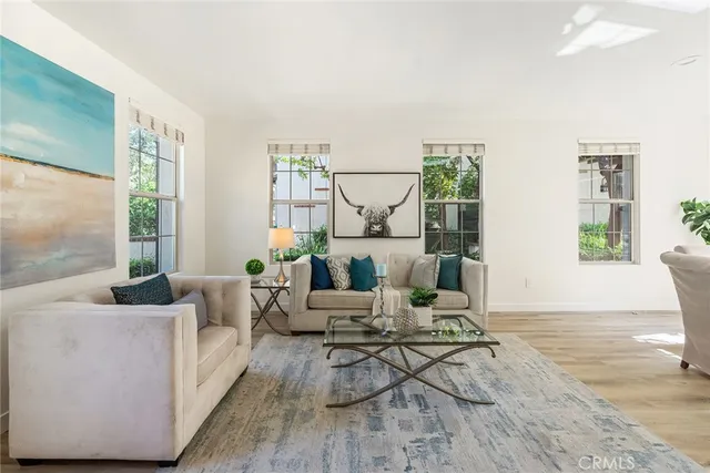 a living room with furniture and a table