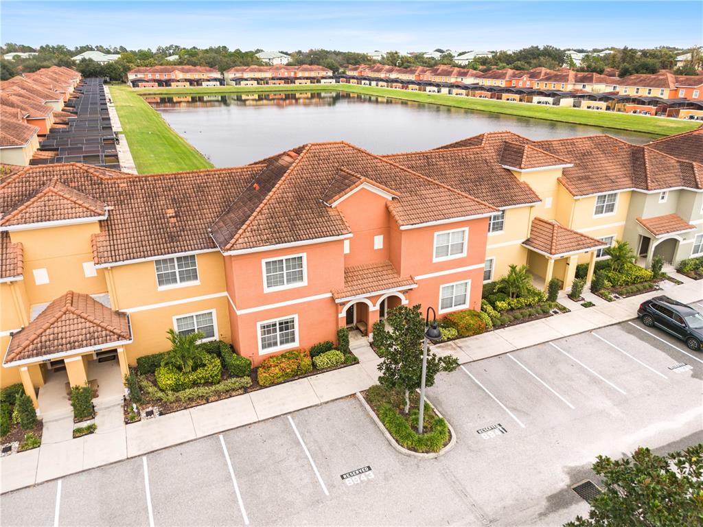 an aerial view of residential building with outdoor space and ocean view