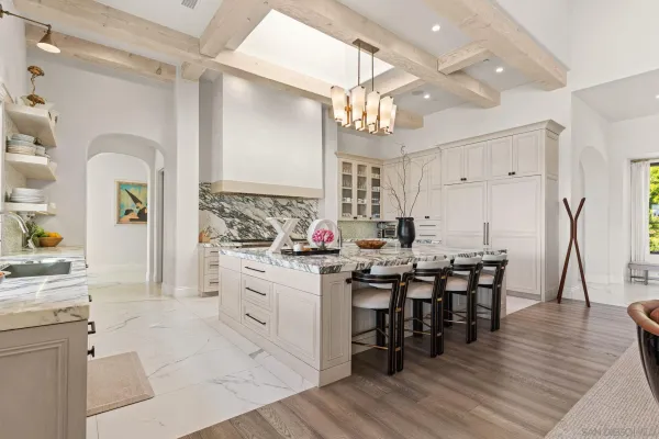 a kitchen with lots of counter top space and dining table