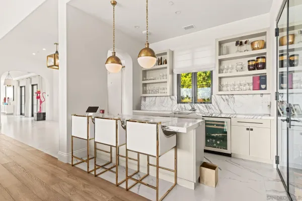 a kitchen with stainless steel appliances granite countertop a stove and cabinets