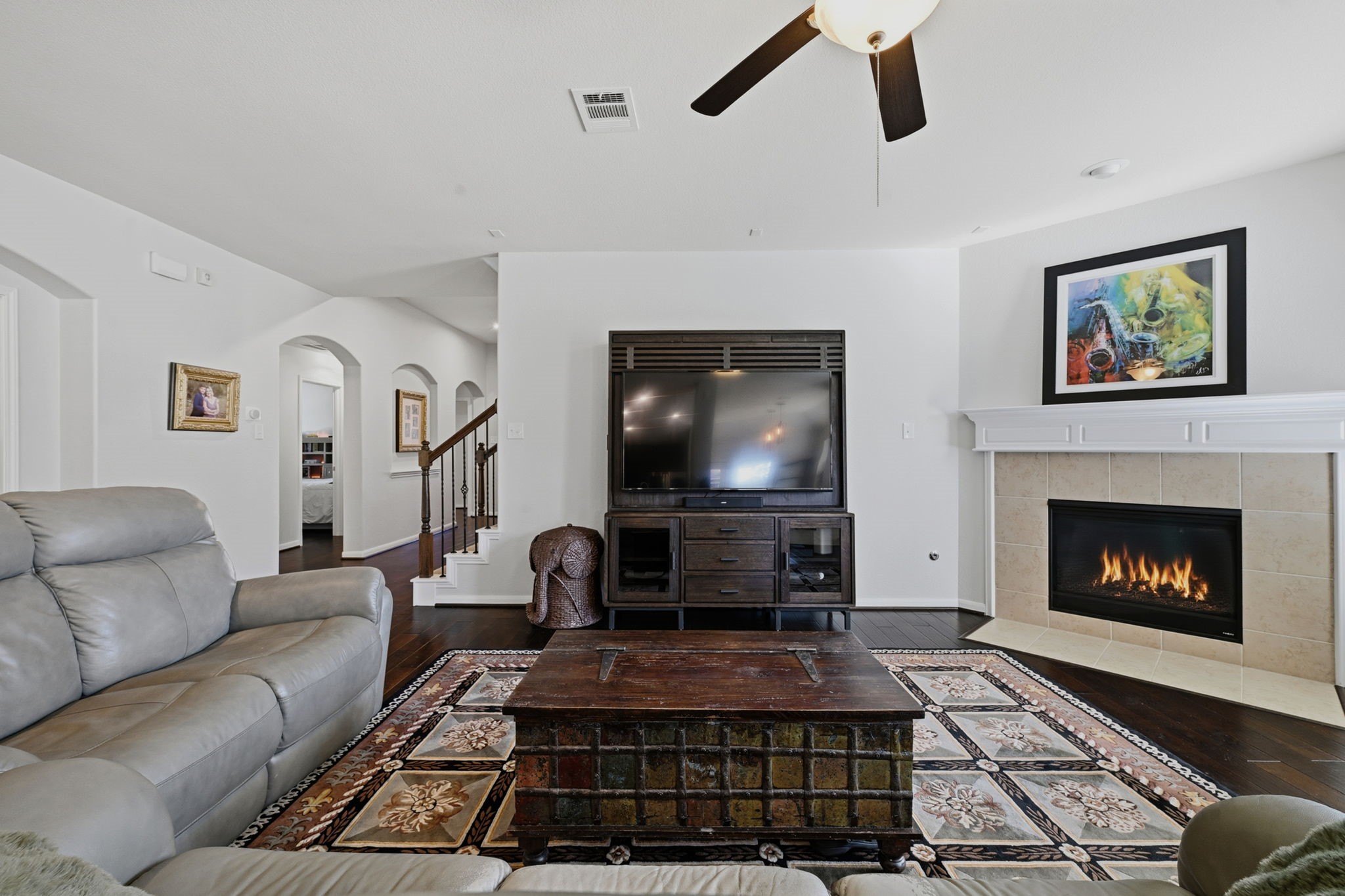 3646 Gable Landing Lane Spring, TX 77386 - Photo 12 of 43 a living room with furniture a flat screen tv and a fireplace