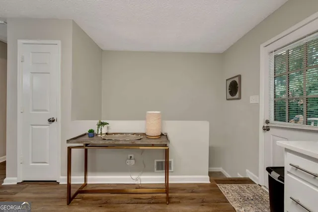 a workspace with furniture and window