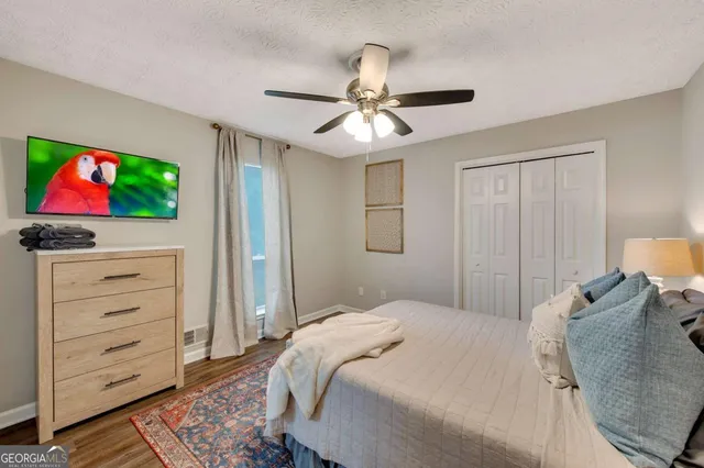 a bedroom with a bed and a cabinet