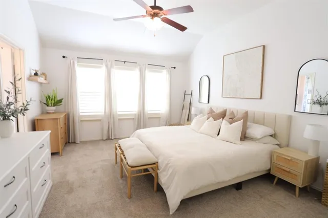 a bedroom with bed and a table