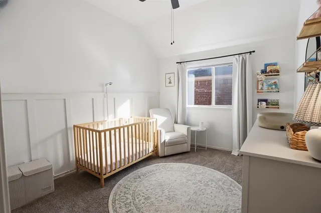 a view of a workspace with a window and lounge chair