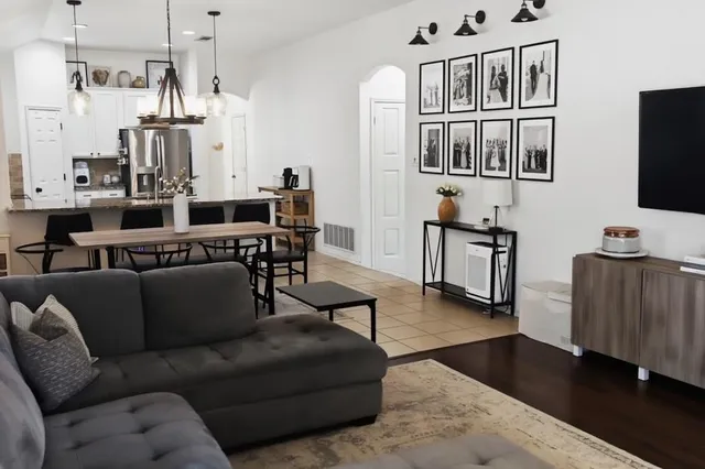 a dining table with chairs and wooden floor