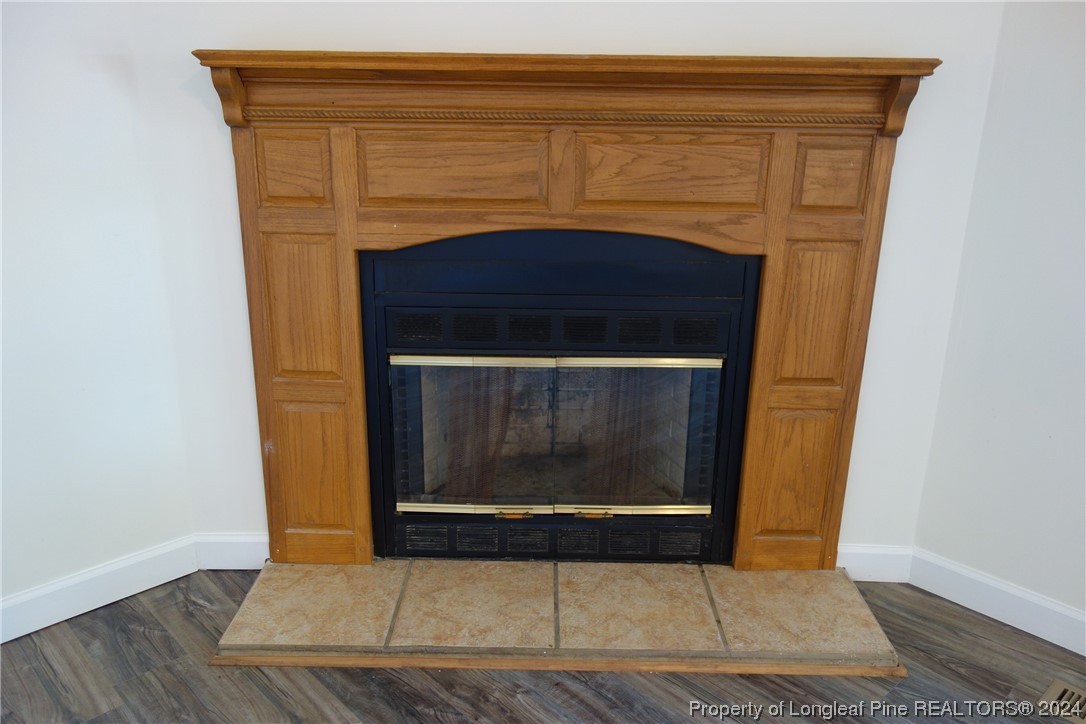 3001 Popes Crossing Road Lumberton, NC 28358 - Photo 16 of 43 a view of fireplace and wooden floor