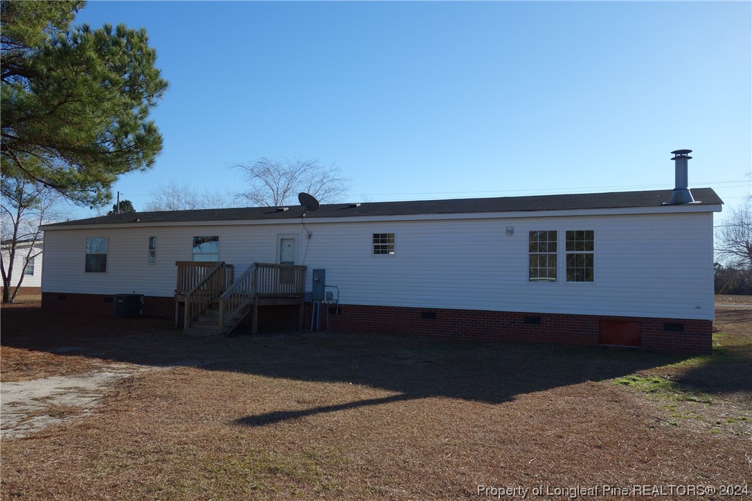 3001 Popes Crossing Road Lumberton, NC 28358 - Photo 17 of 43 a view of a house with a backyard