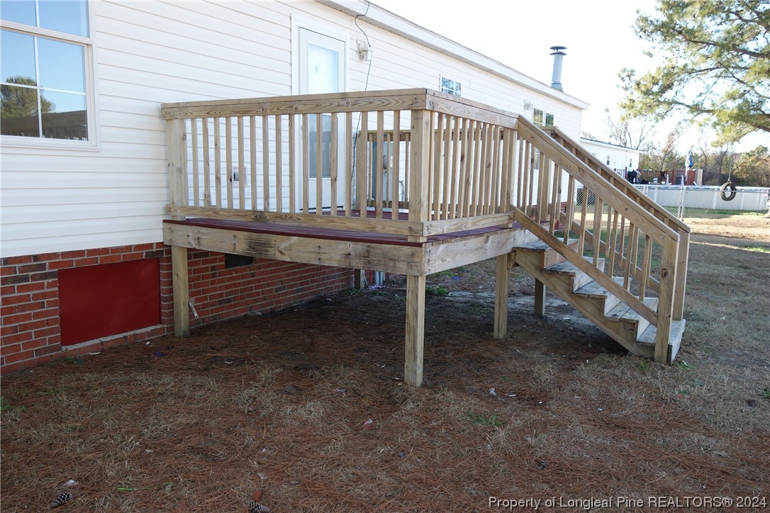 3001 Popes Crossing Road Lumberton, NC 28358 - Photo 18 of 43 a view of entryway with wooden stairs
