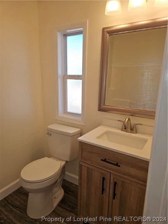 3001 Popes Crossing Road Lumberton, NC 28358 - Photo 29 of 43 a bathroom with a toilet sink and mirror