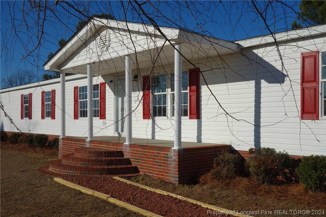 3001 Popes Crossing Road Lumberton, NC 28358 - Photo 3 of 43 a front view of a house with a yard