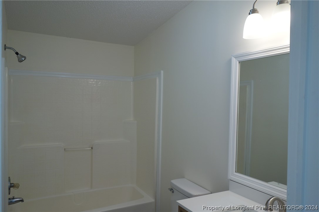 3001 Popes Crossing Road Lumberton, NC 28358 - Photo 35 of 43 a bathroom with a toilet and shower
