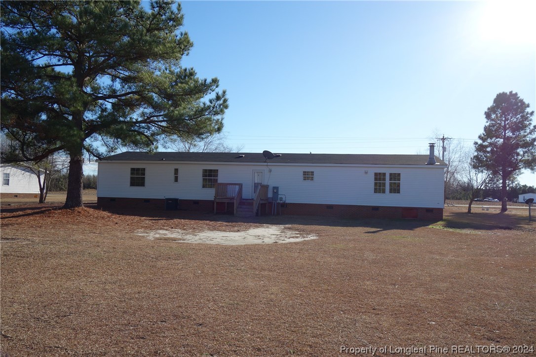 3001 Popes Crossing Road Lumberton, NC 28358 - Photo 42 of 43 a view of a house with a yard