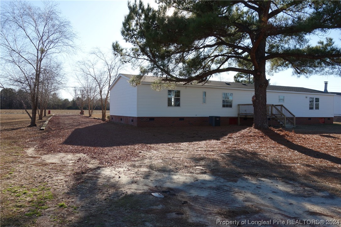 3001 Popes Crossing Road Lumberton, NC 28358 - Photo 8 of 43 a view of a backyard of the house