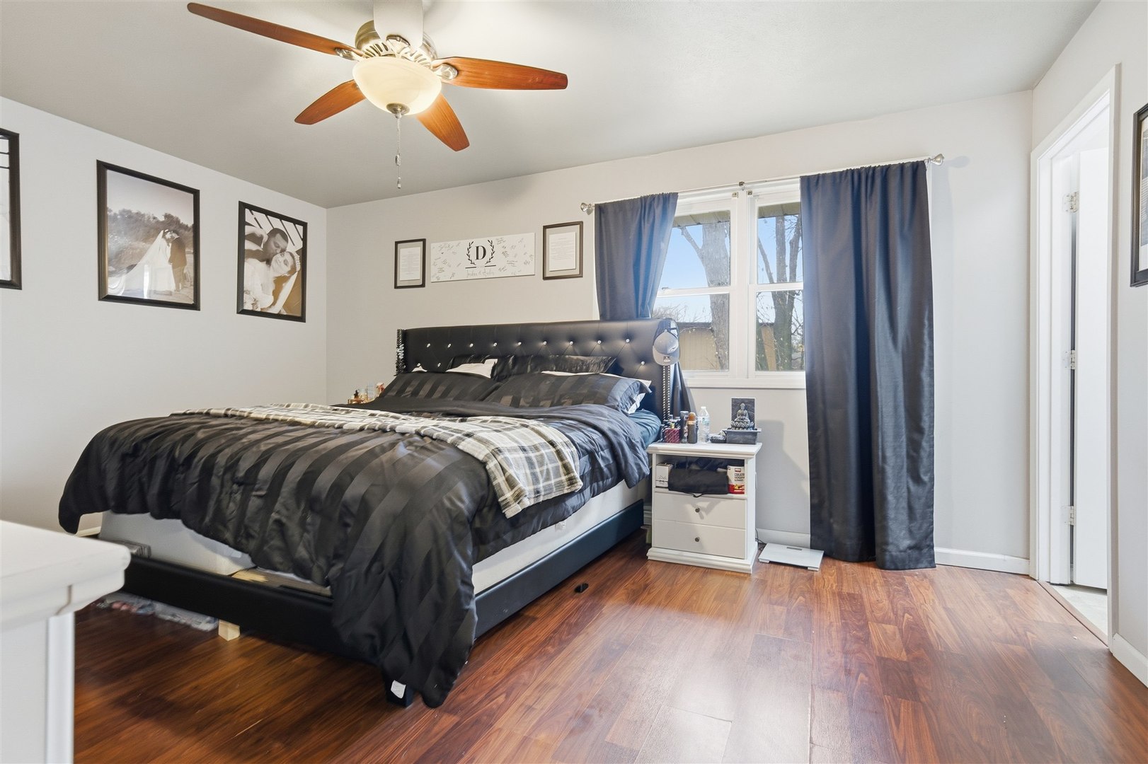 901 Charlotte Drive Normal, IL 61761 - Photo 17 of 32 a bedroom with a bed and wooden floor