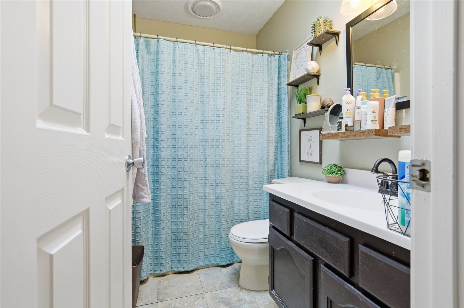 901 Charlotte Drive Normal, IL 61761 - Photo 19 of 32 a bathroom with a sink a toilet and shower