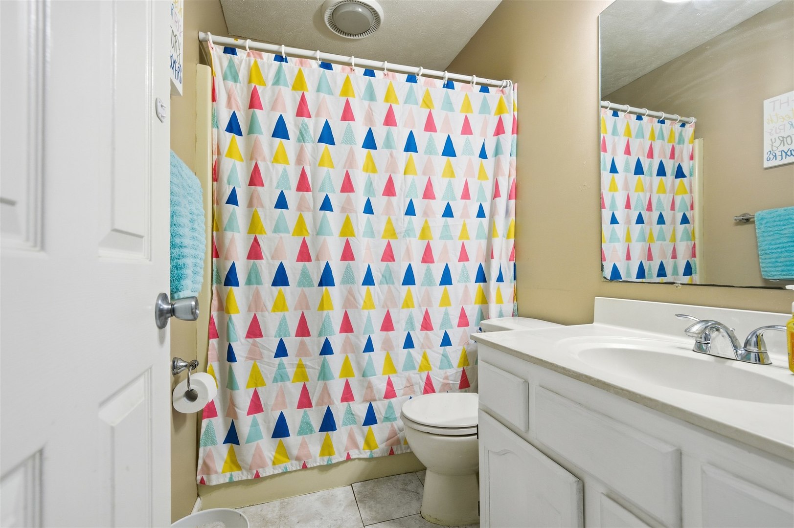 901 Charlotte Drive Normal, IL 61761 - Photo 22 of 32 a bathroom with a sink toilet and shower curtain