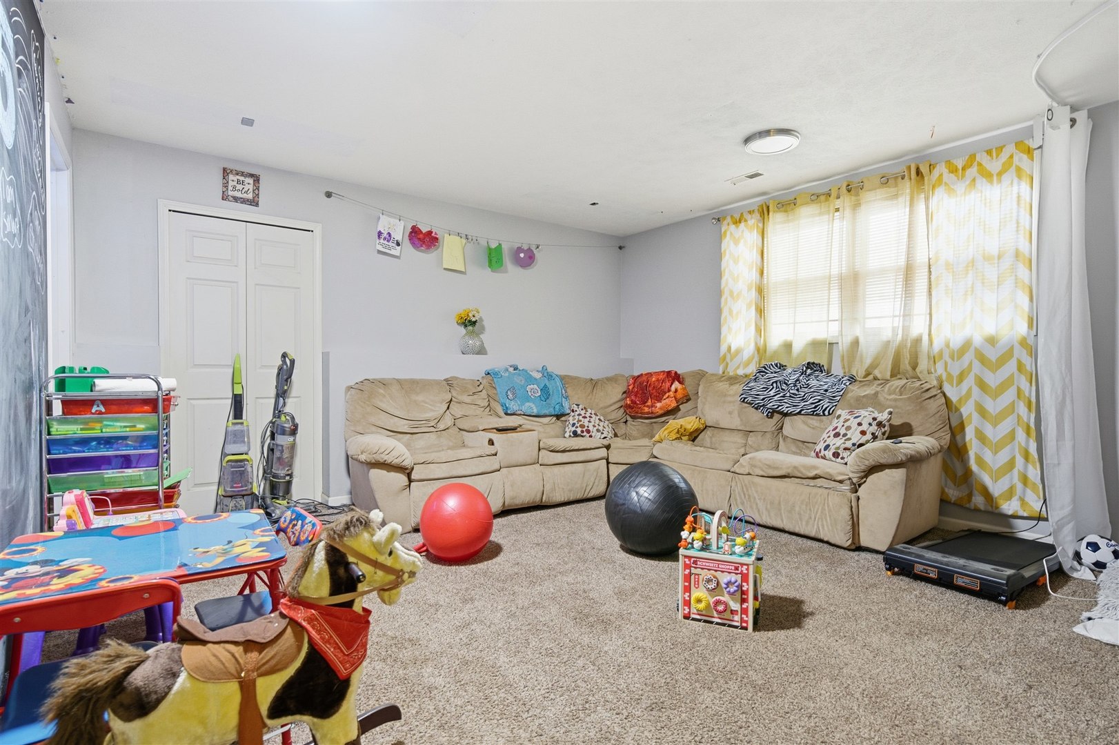 901 Charlotte Drive Normal, IL 61761 - Photo 24 of 32 a living room with baby toys and furniture