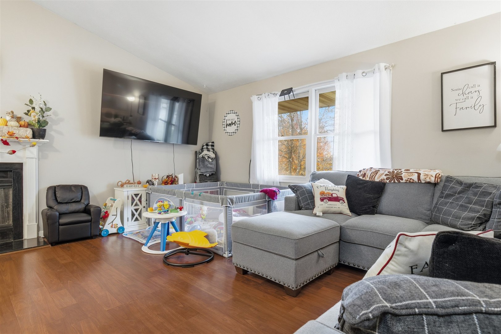 901 Charlotte Drive Normal, IL 61761 - Photo 6 of 32 a living room with furniture and a flat screen tv