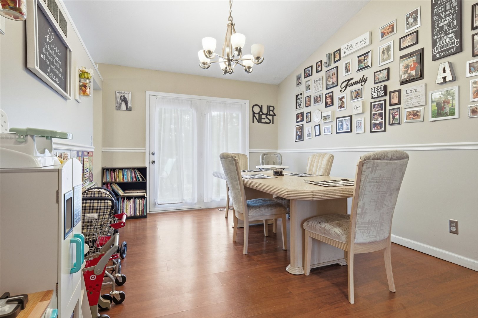 901 Charlotte Drive Normal, IL 61761 - Photo 8 of 32 a view of a dining room with furniture and chandelier