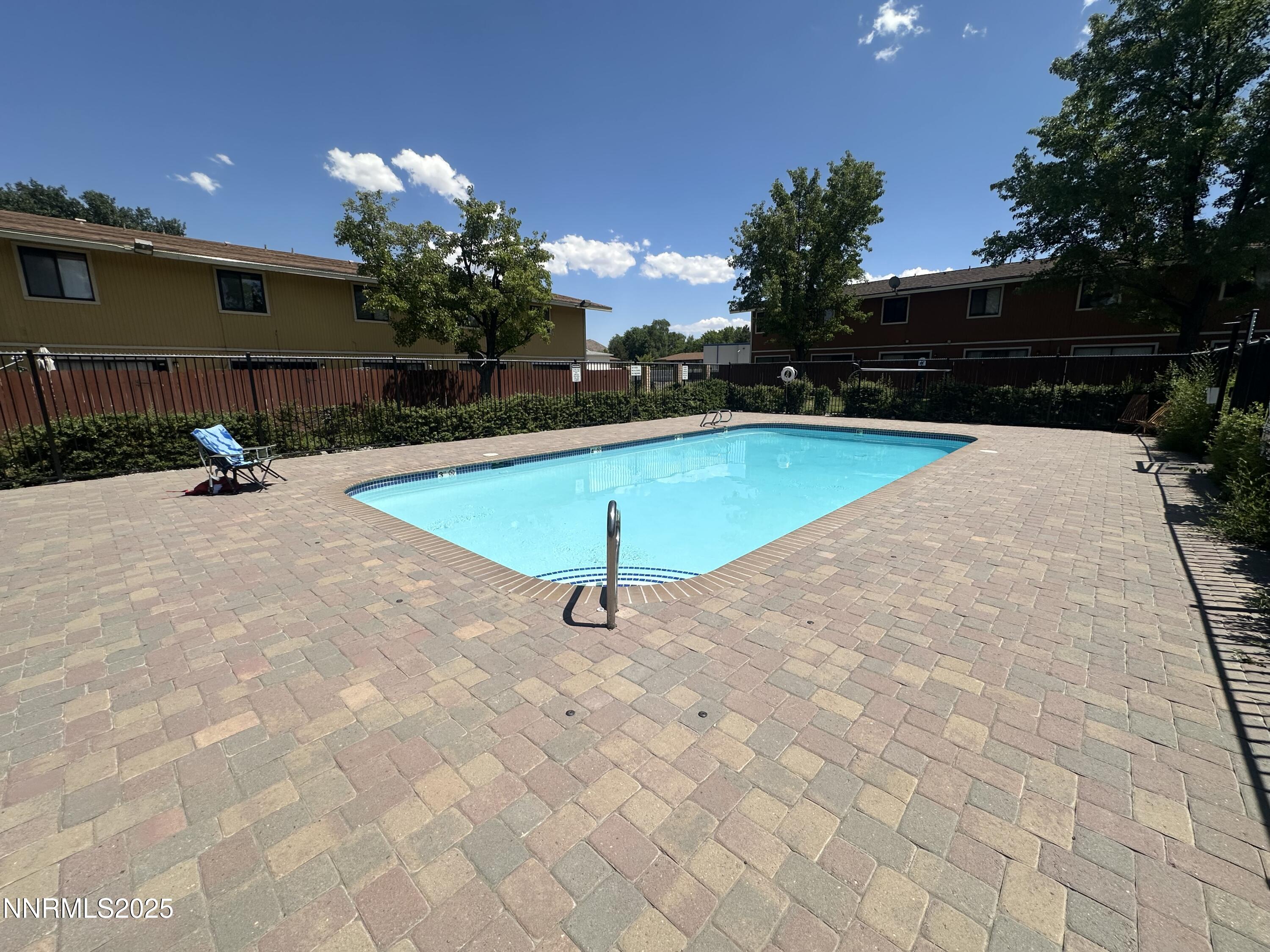 863 Nutmeg Place, Unit 12 Reno, NV 89502 - Photo 20 of 31 a view of a swimming pool with a yard