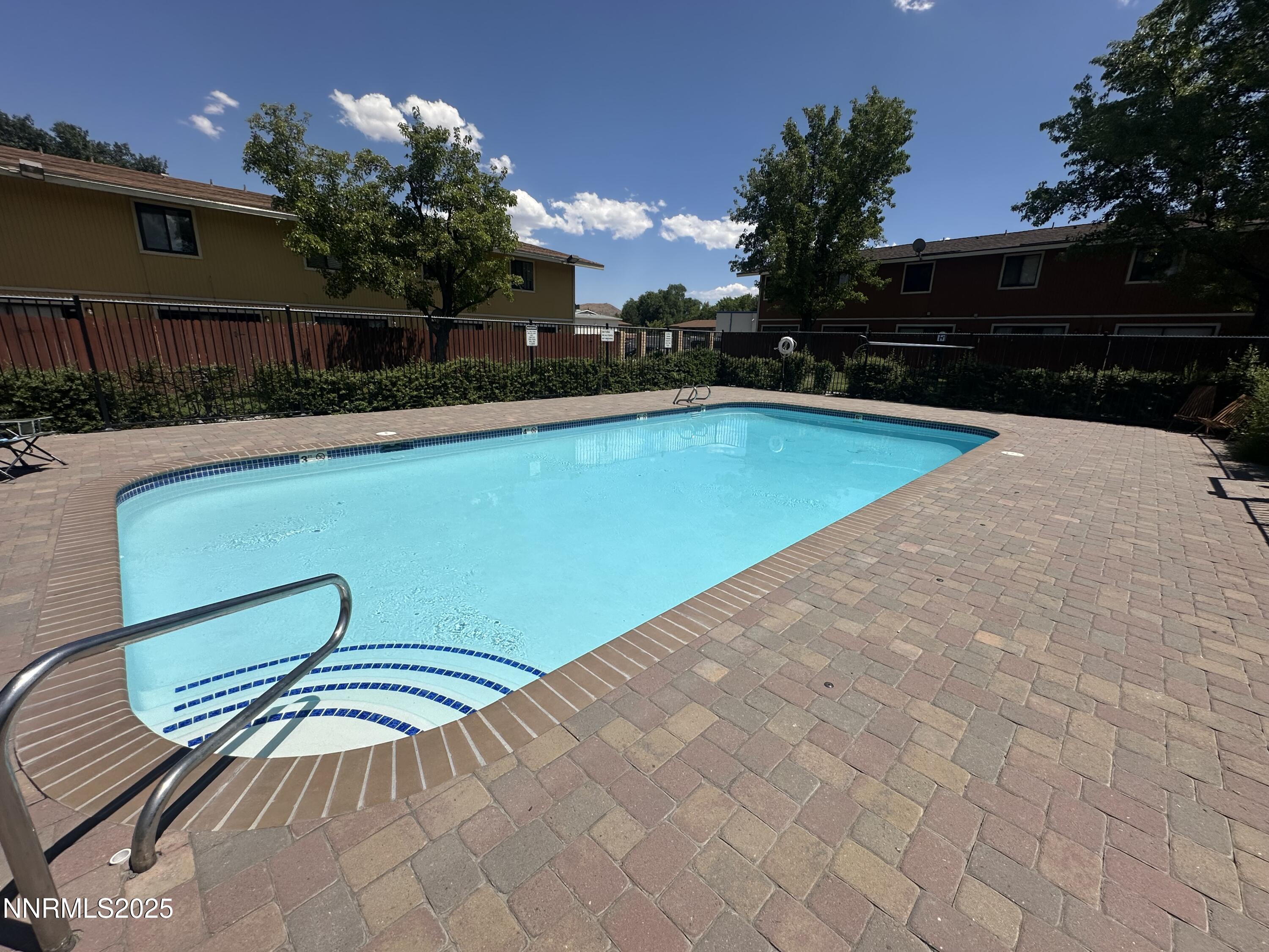 863 Nutmeg Place, Unit 12 Reno, NV 89502 - Photo 22 of 31 a view of a swimming pool with a yard
