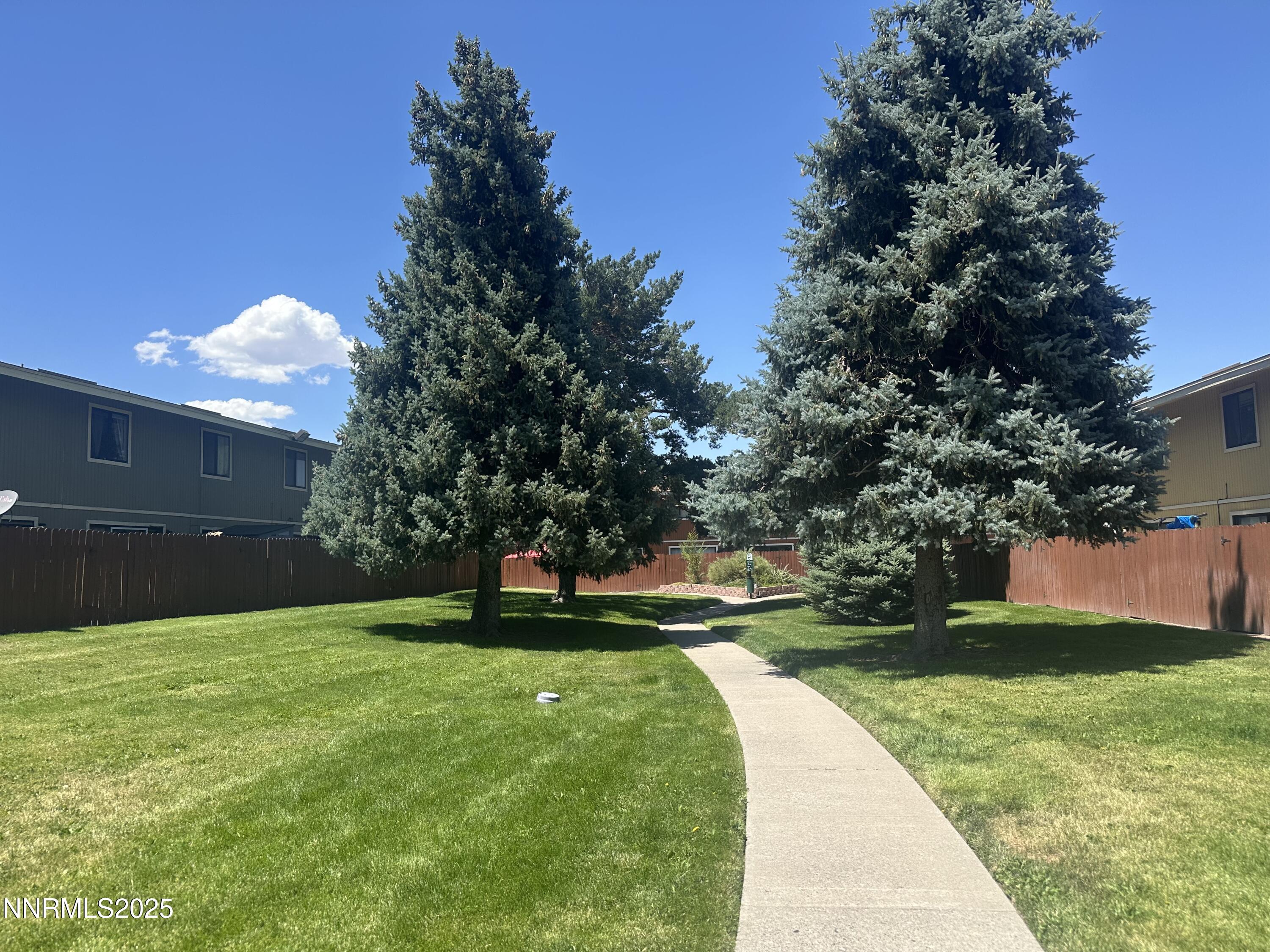 863 Nutmeg Place, Unit 12 Reno, NV 89502 - Photo 23 of 31 a view of building with garden