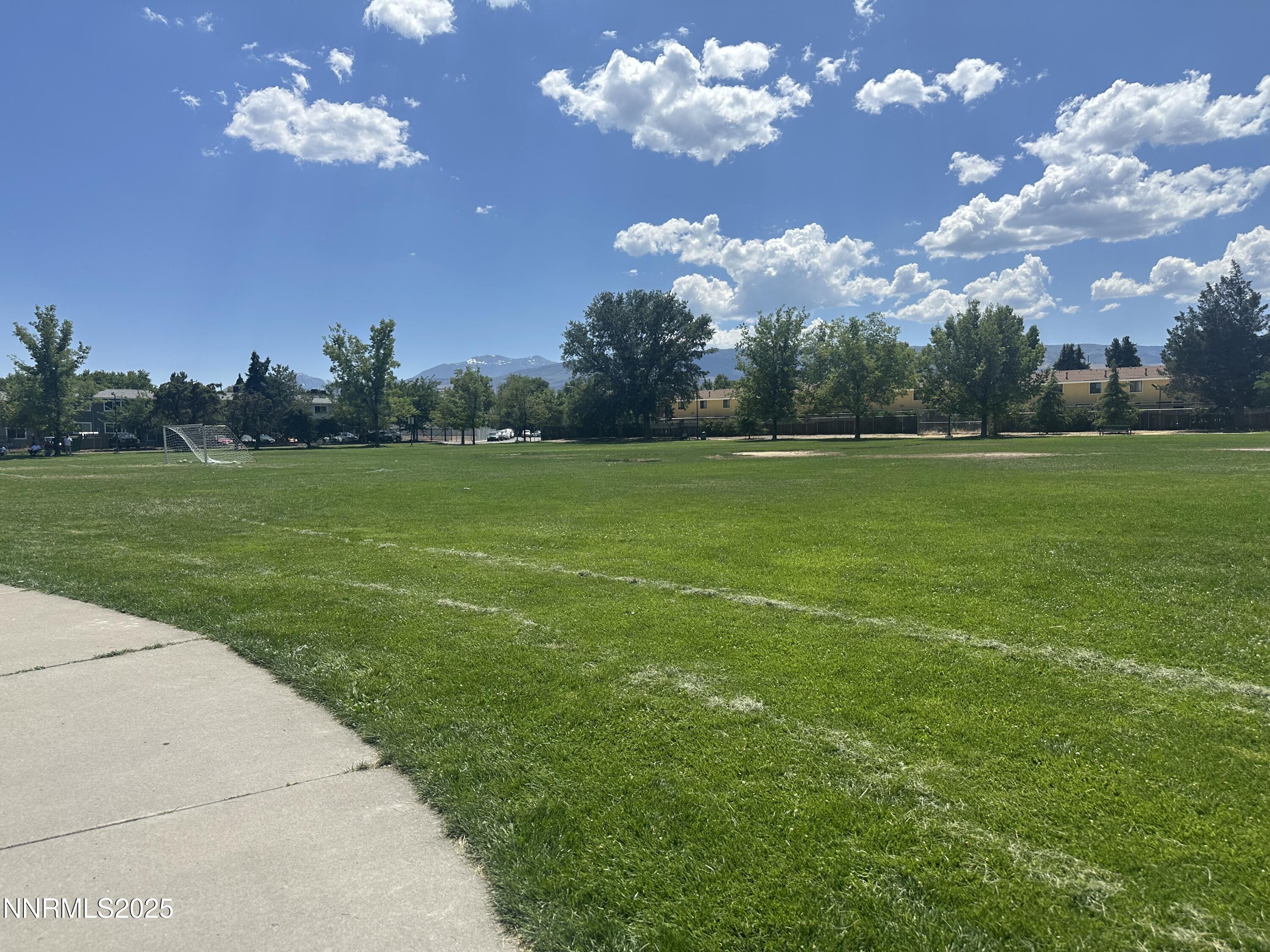 863 Nutmeg Place, Unit 12 Reno, NV 89502 - Photo 28 of 31 a view of a golf course with a lake