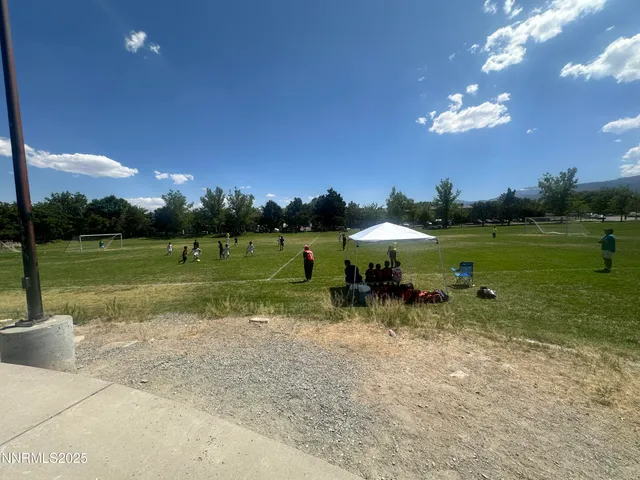 a view of a golf course with a lake view