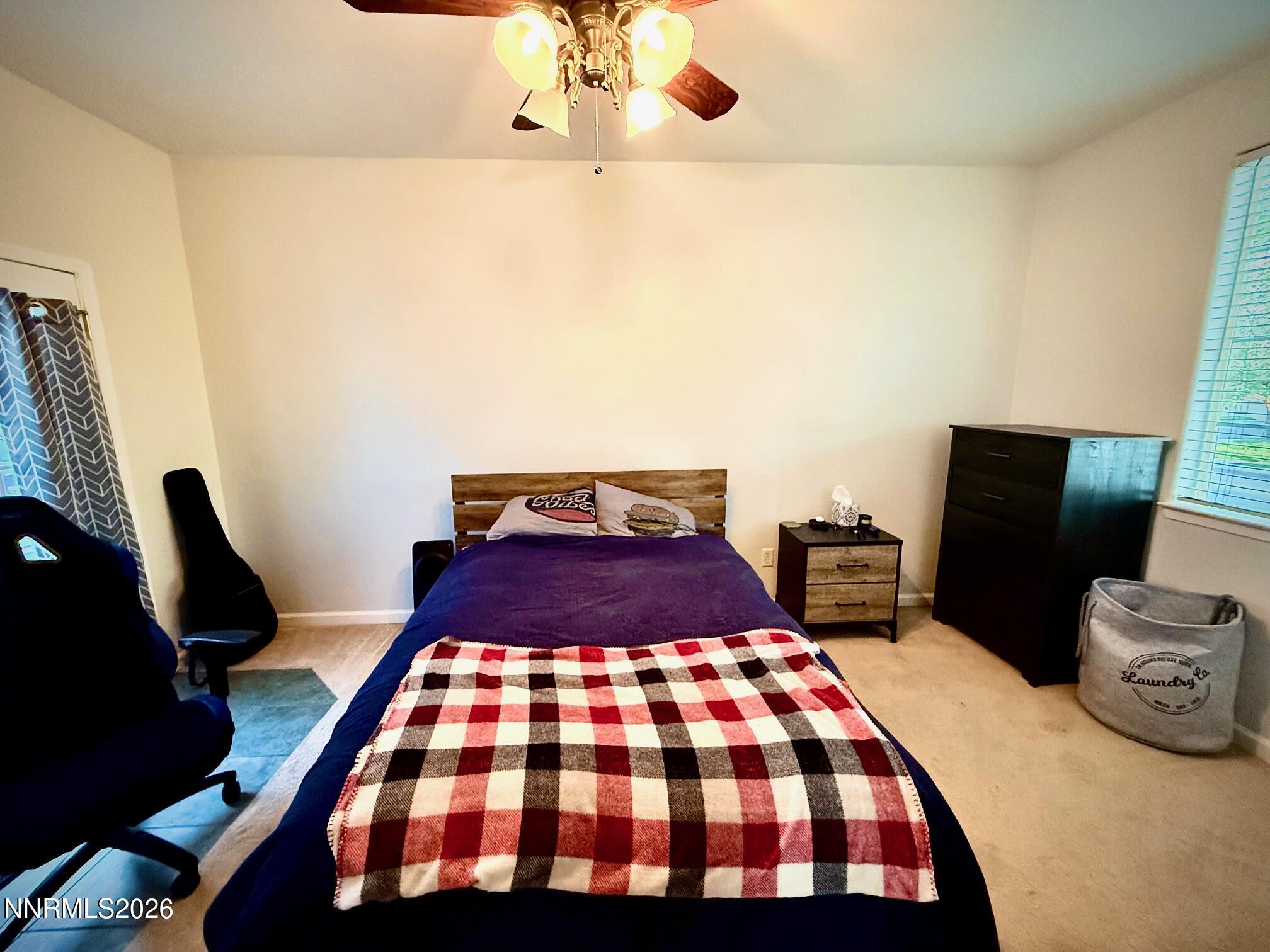 1771 Emerald Bay Drive Reno, NV 89521 - Photo 11 of 31 a bedroom with a bed and dresser