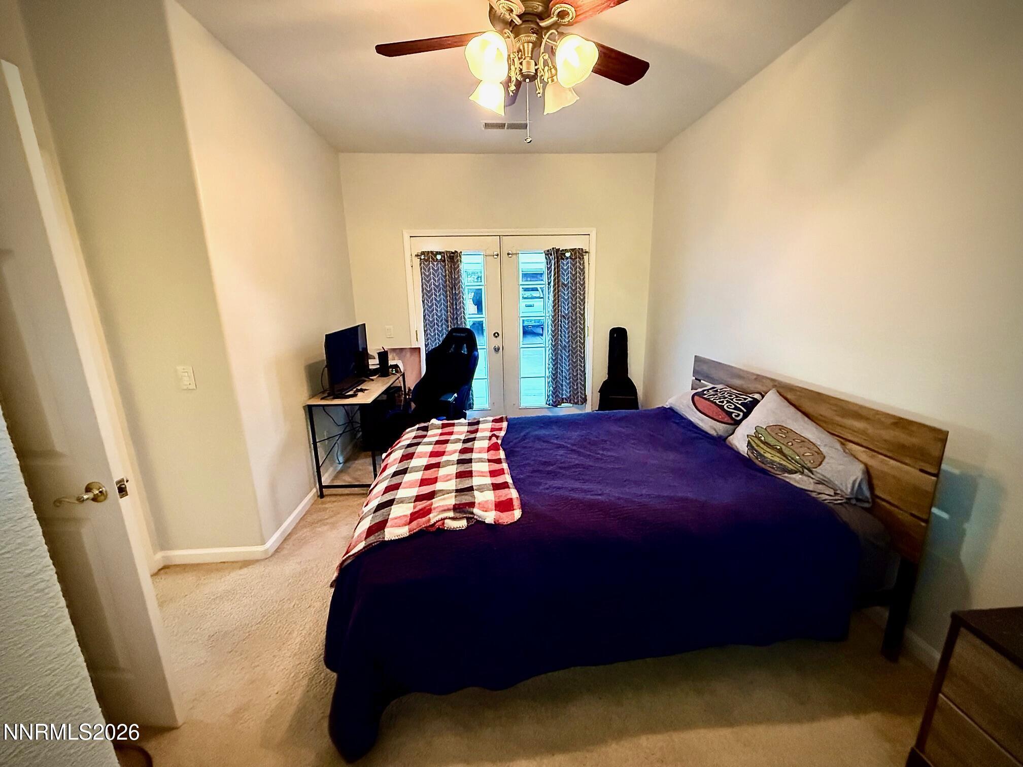 1771 Emerald Bay Drive Reno, NV 89521 - Photo 12 of 31 a bedroom with a bed and wooden floor