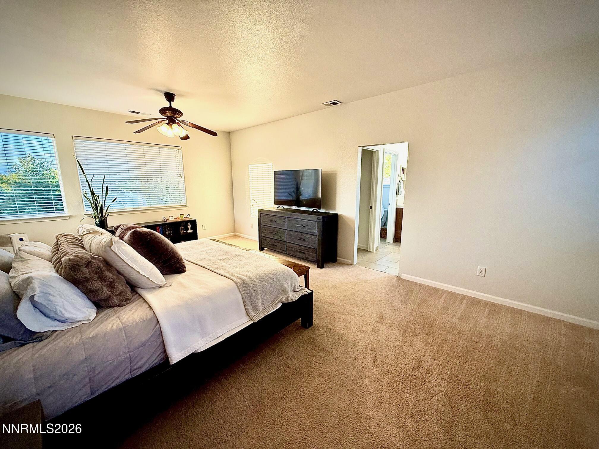 1771 Emerald Bay Drive Reno, NV 89521 - Photo 13 of 31 a bedroom with a bed and wooden floor